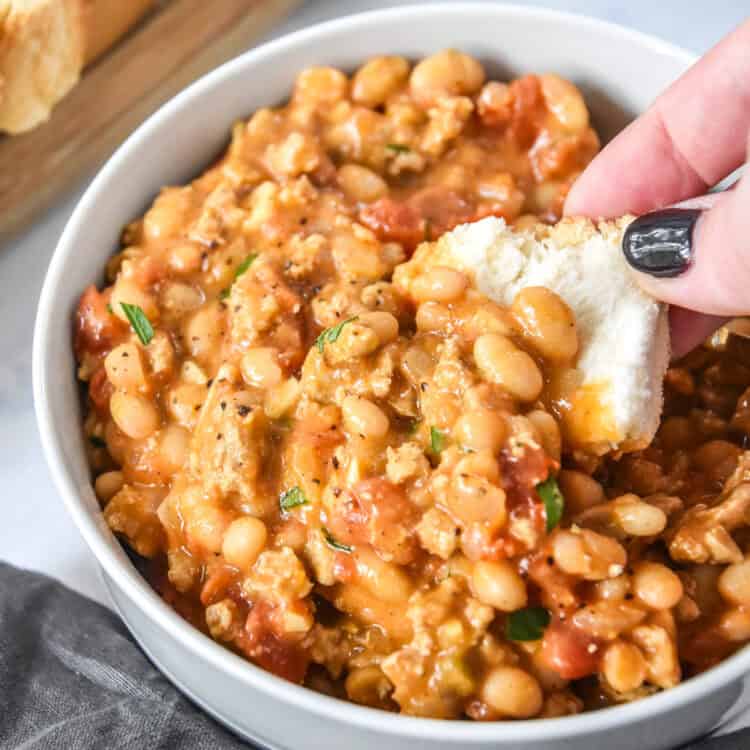 dipping breading into the sloppy ground turkey white bean skillet.