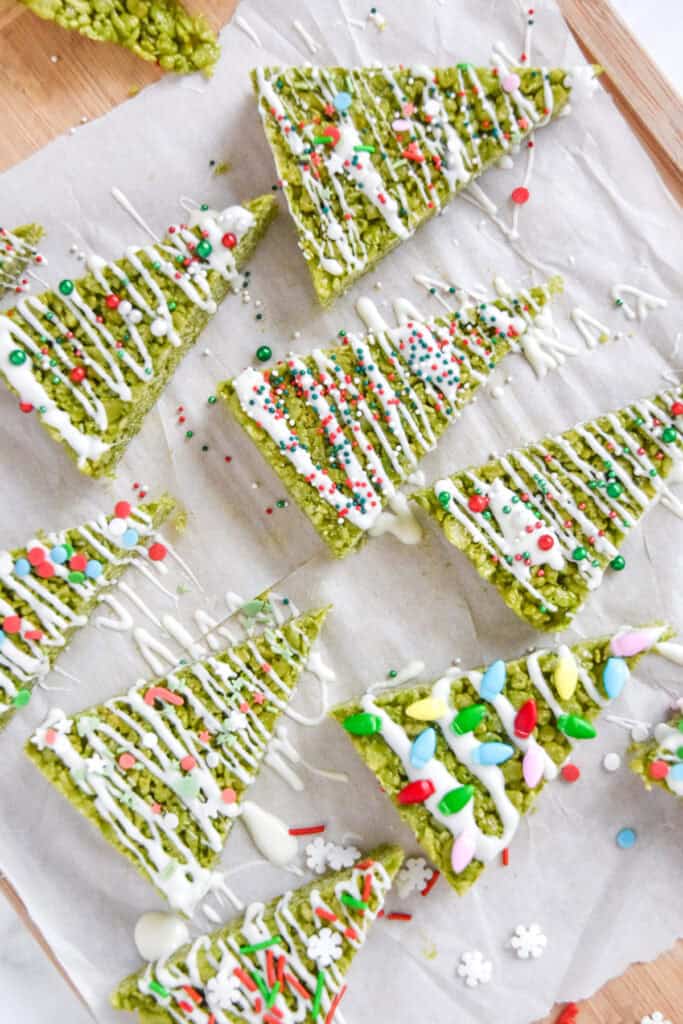 decorated easy christmas tree rice krispies treats on parchment paper.