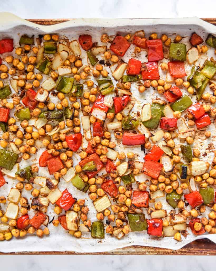 roasted chickpeas, peppers and onions roasted in the oven to make the roasted chickpea taco bowls.