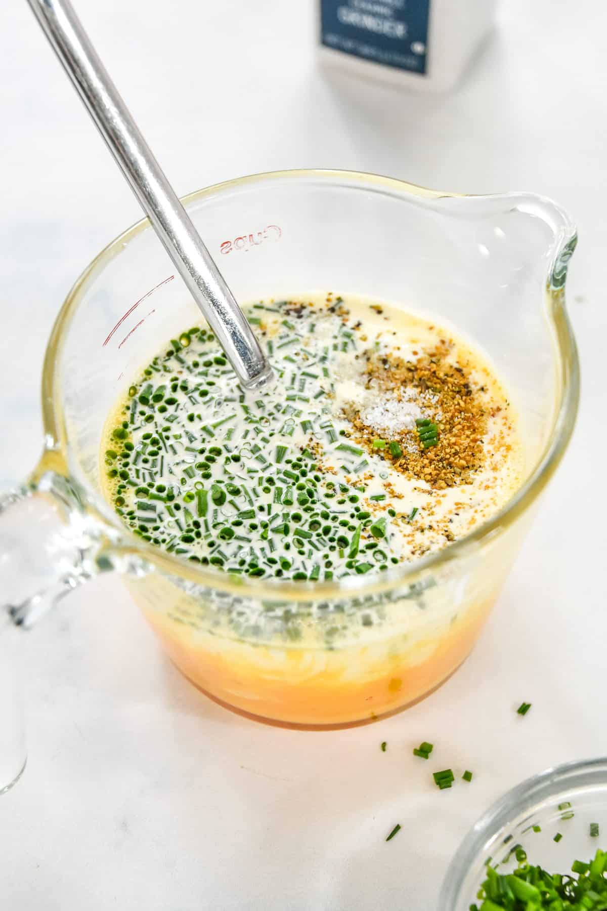 custard for quiches in a measuring cup with spout.