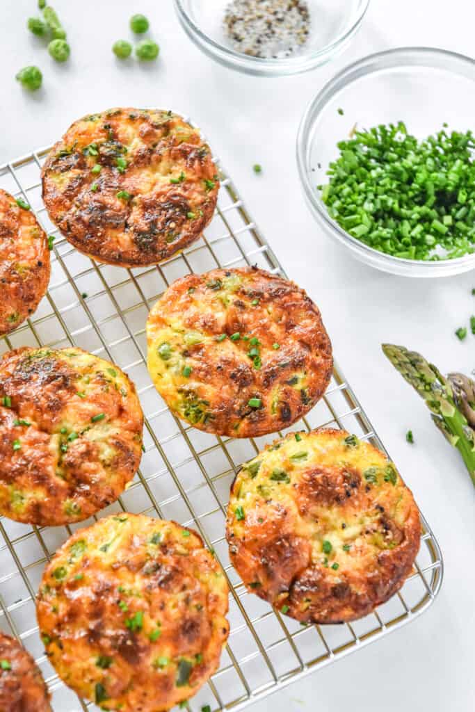 mini crustless quiches on a wire cooling rack.