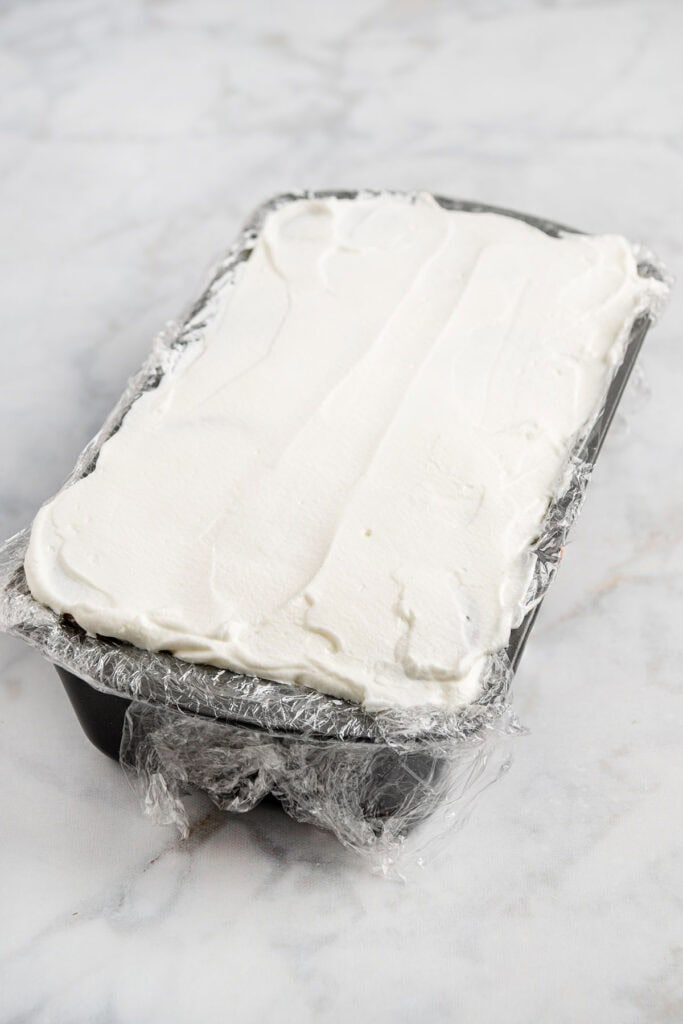 strawberry gingersnap icebox cake in a loaf pan just made.