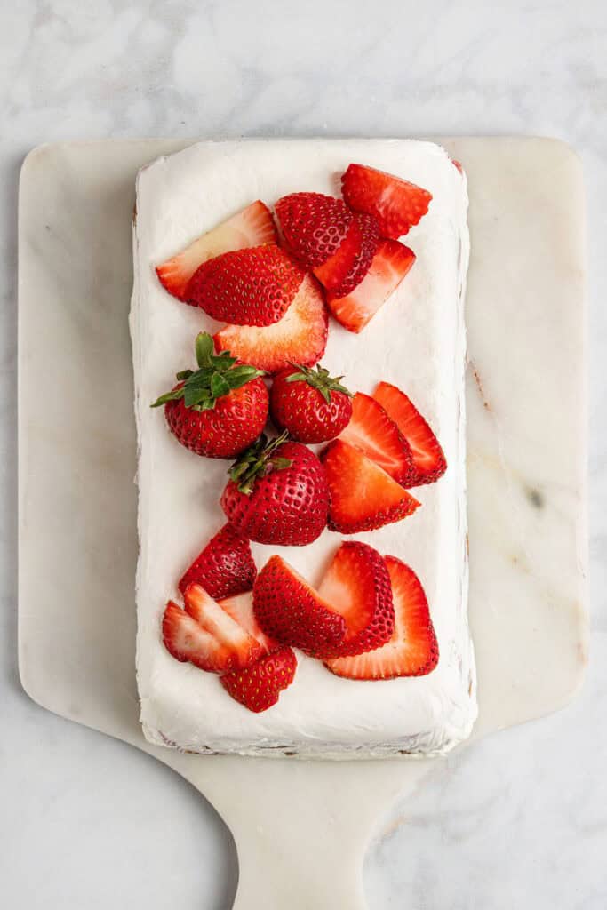 strawberry gingersnap icebox cake with fresh strawberries on top.