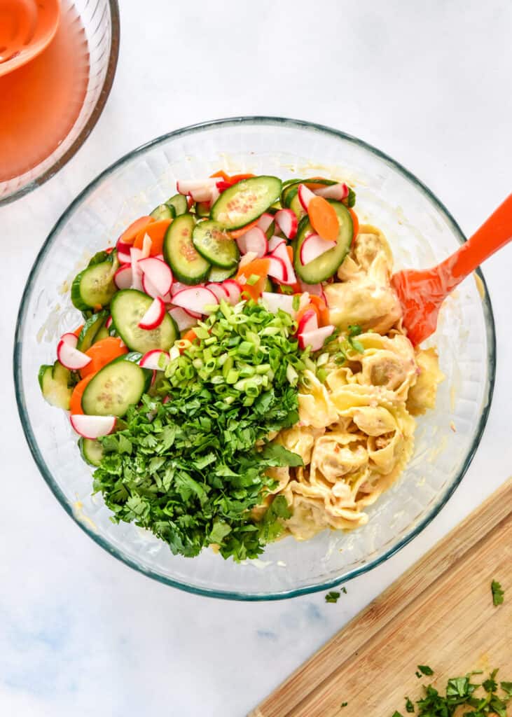 all ingredients for the banh mi inspired tortellini salad with pickled veggies and fresh cilantro.