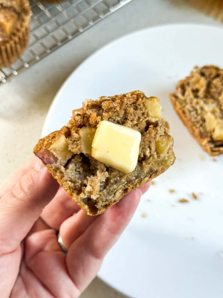 oatmeal applesauce blender muffin cut in half with butter.