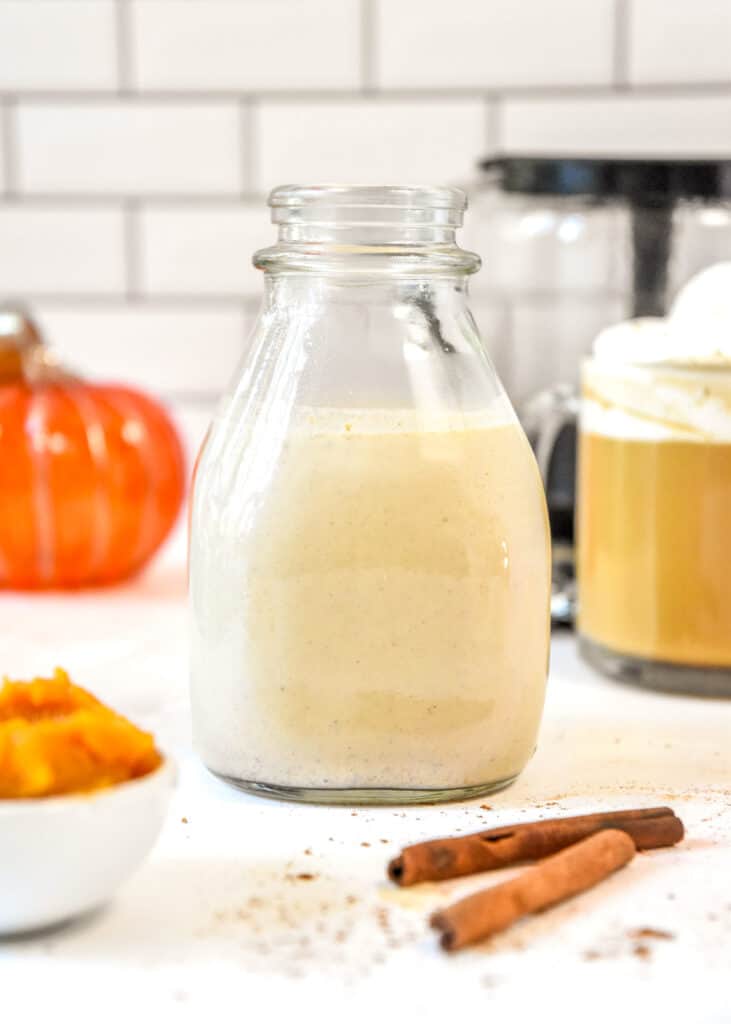 homemade pumpkin spice coffee creamer in a glass jug.